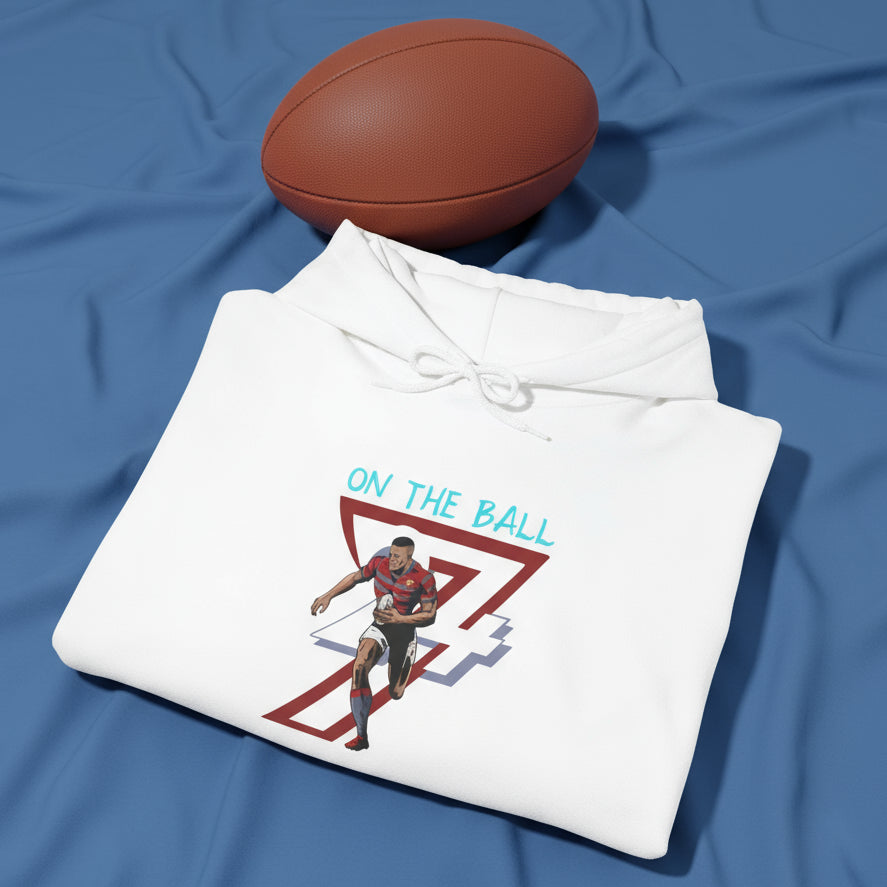 white rugby hoodie with vibrant hand-drawn rugby player illustration and "ON THE BALL" text