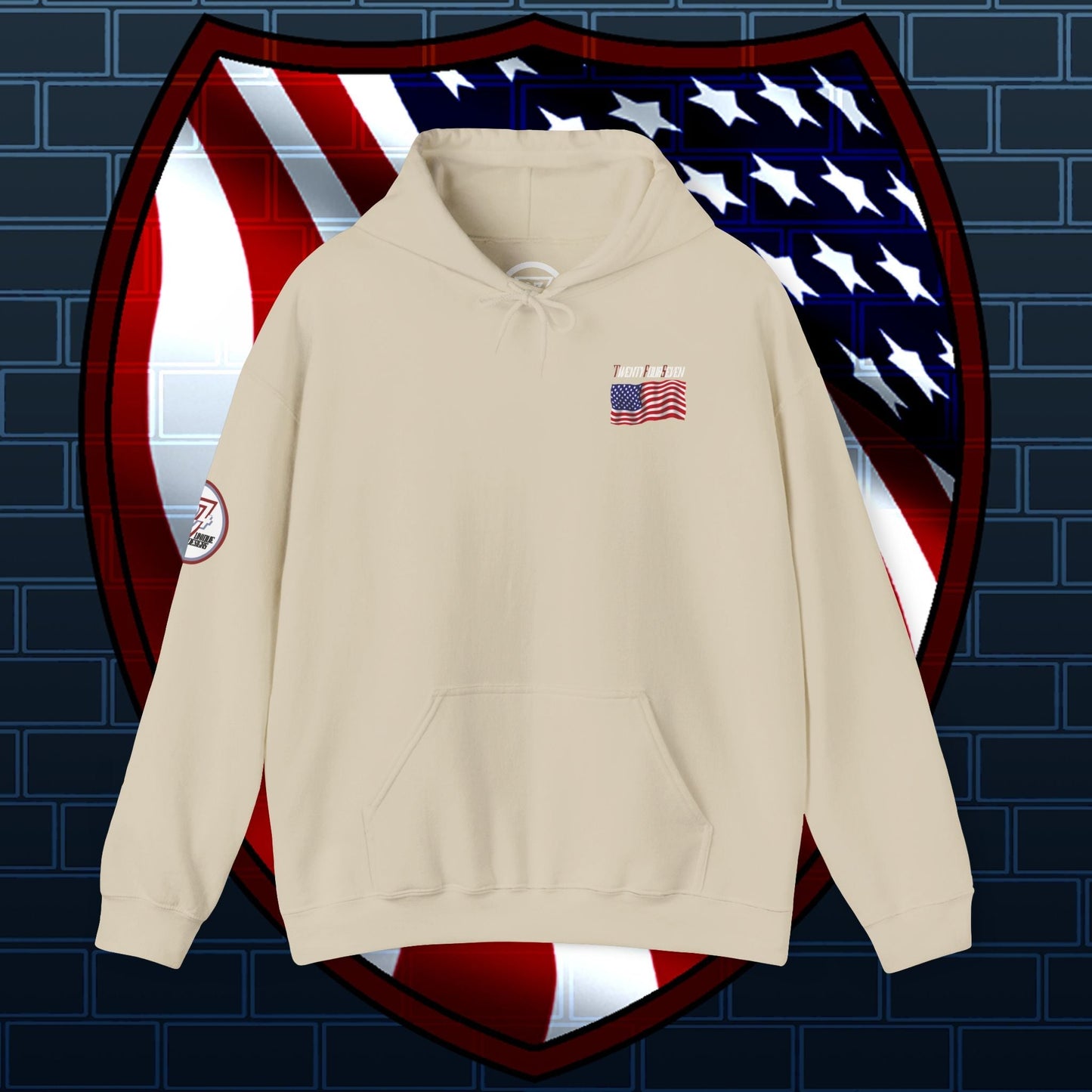 Beige US flag hoodie with small American flag design on chest and patch on sleeve, displayed against a stylized American flag shield background