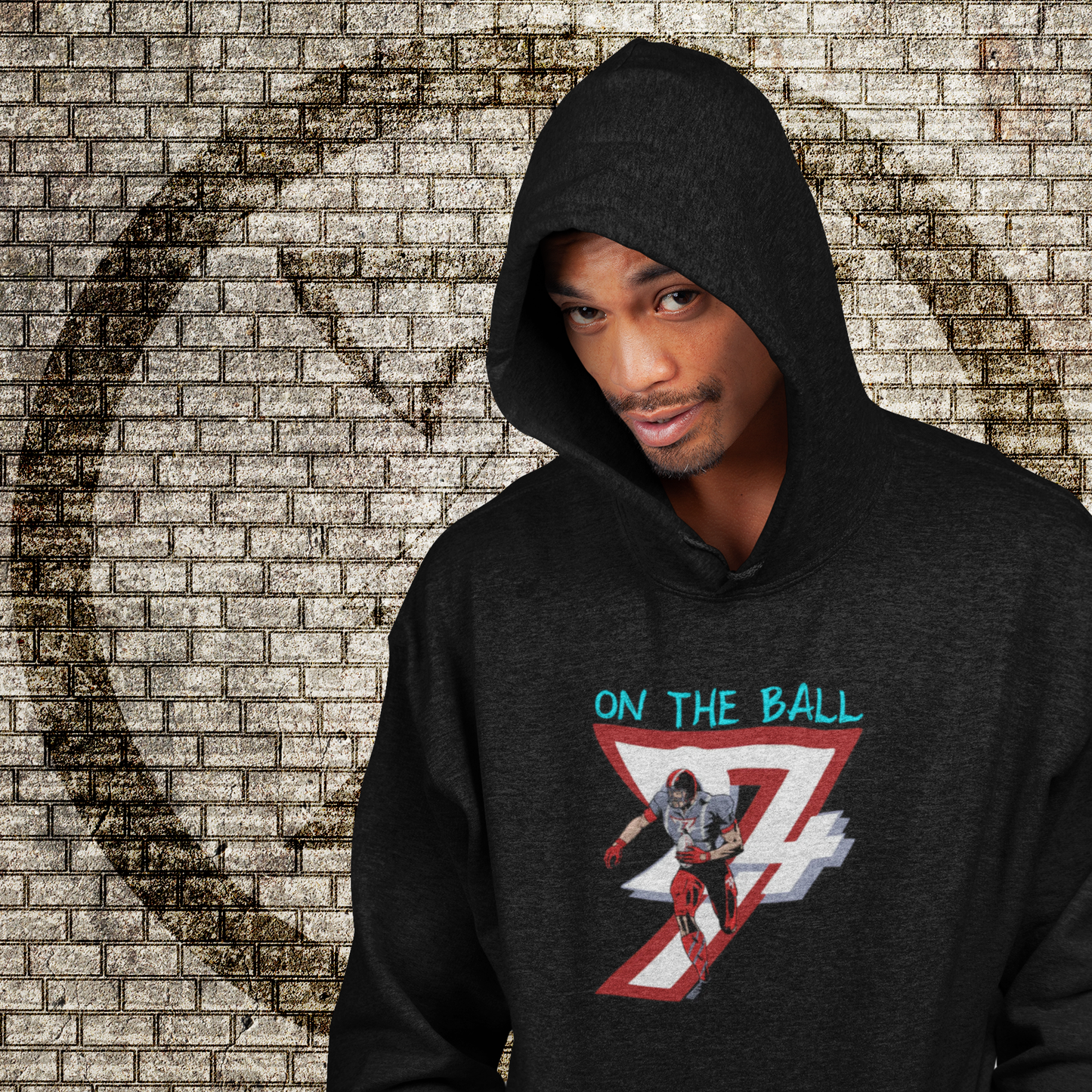 Black american football hoodie with hand-drawn player design and "On The Ball" text