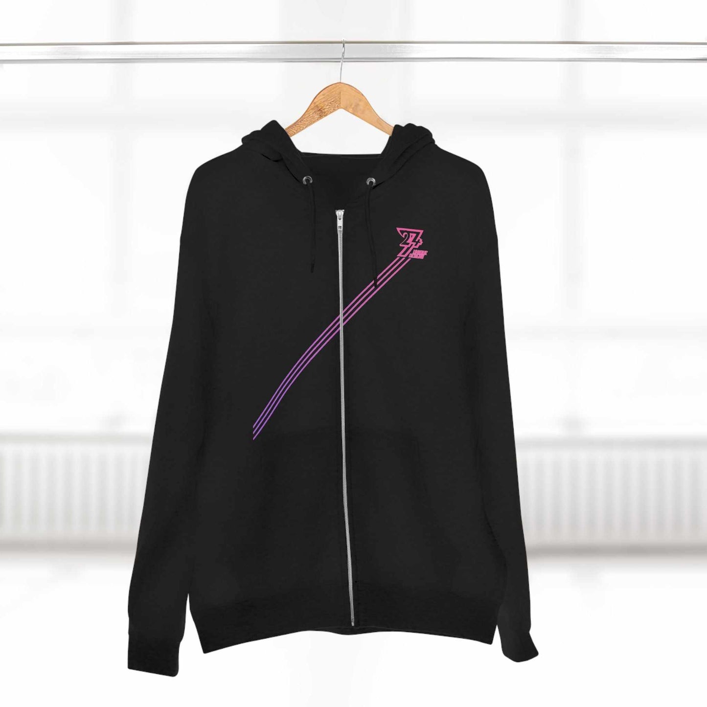 Black women hoodie with pink-striped diagonal design and zipper closure hanging on wooden hanger