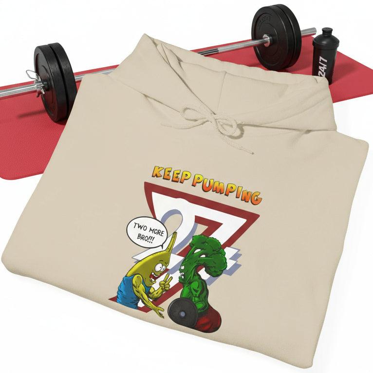 Cartoon broccoli and banana workout hoodie with "Keep Pumping" design and training buddies illustration