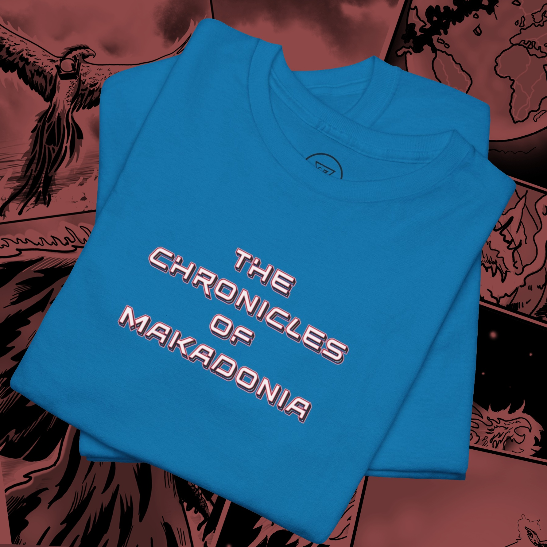 Close-up of Makadonia Comics graphic print detail on sapphire t-shirt, showing vibrant colors and comic art style