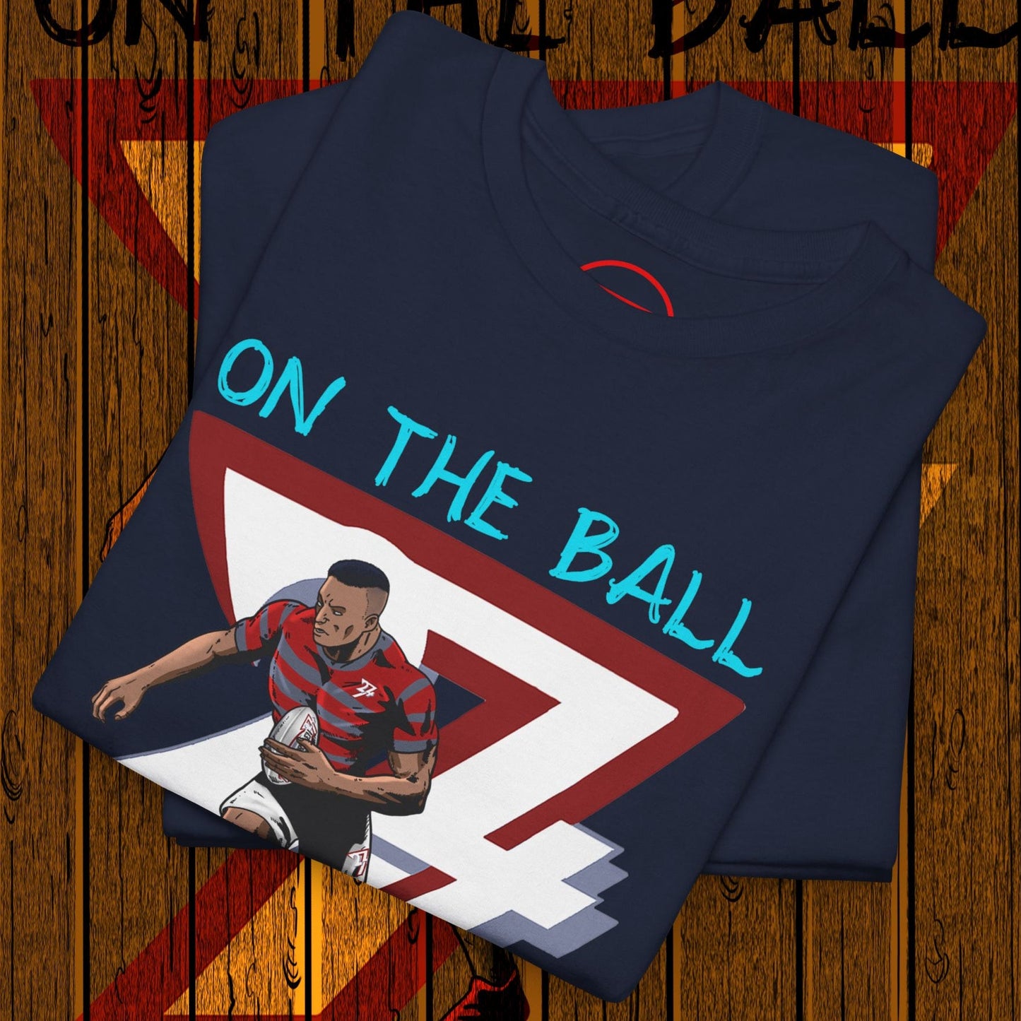Comic-style rugby player t-shirt with hand-drawn athlete graphic and "On The Ball" text on navy fabric