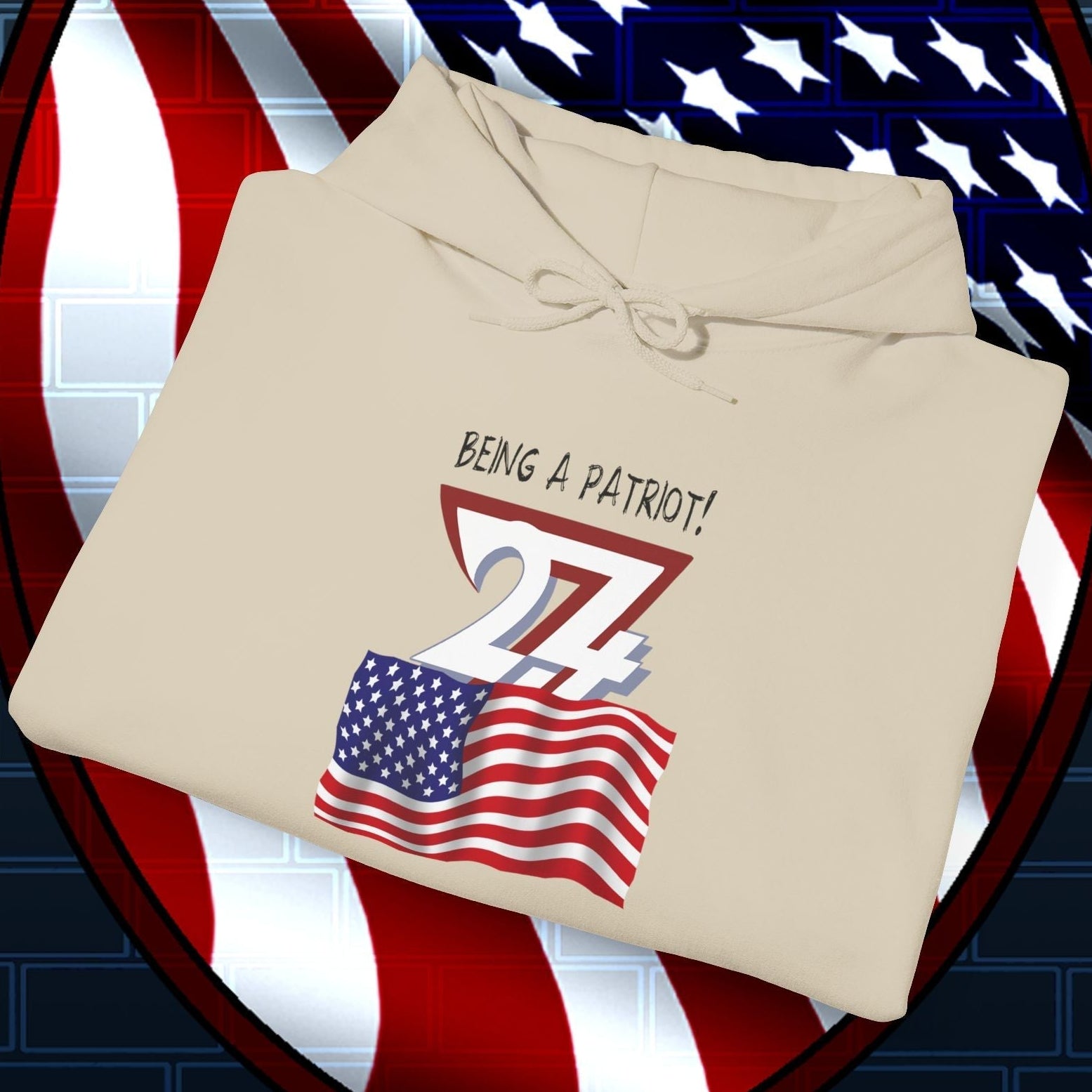 Folded beige USA flag hoodie with patriotic hand-drawn design and "Being a Patriot!" text folded on American flag background