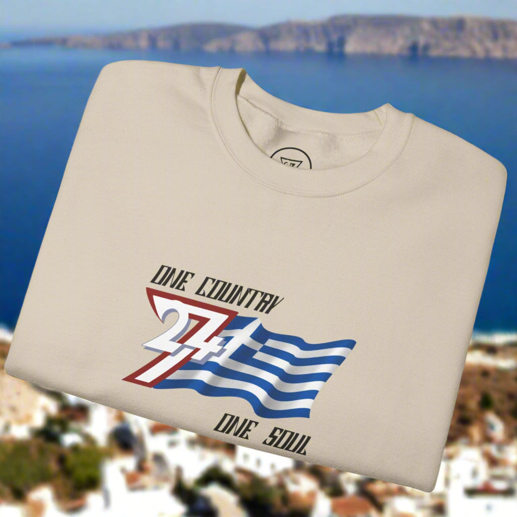 Folded beige t-shirt with graphic design of the Greece national flag