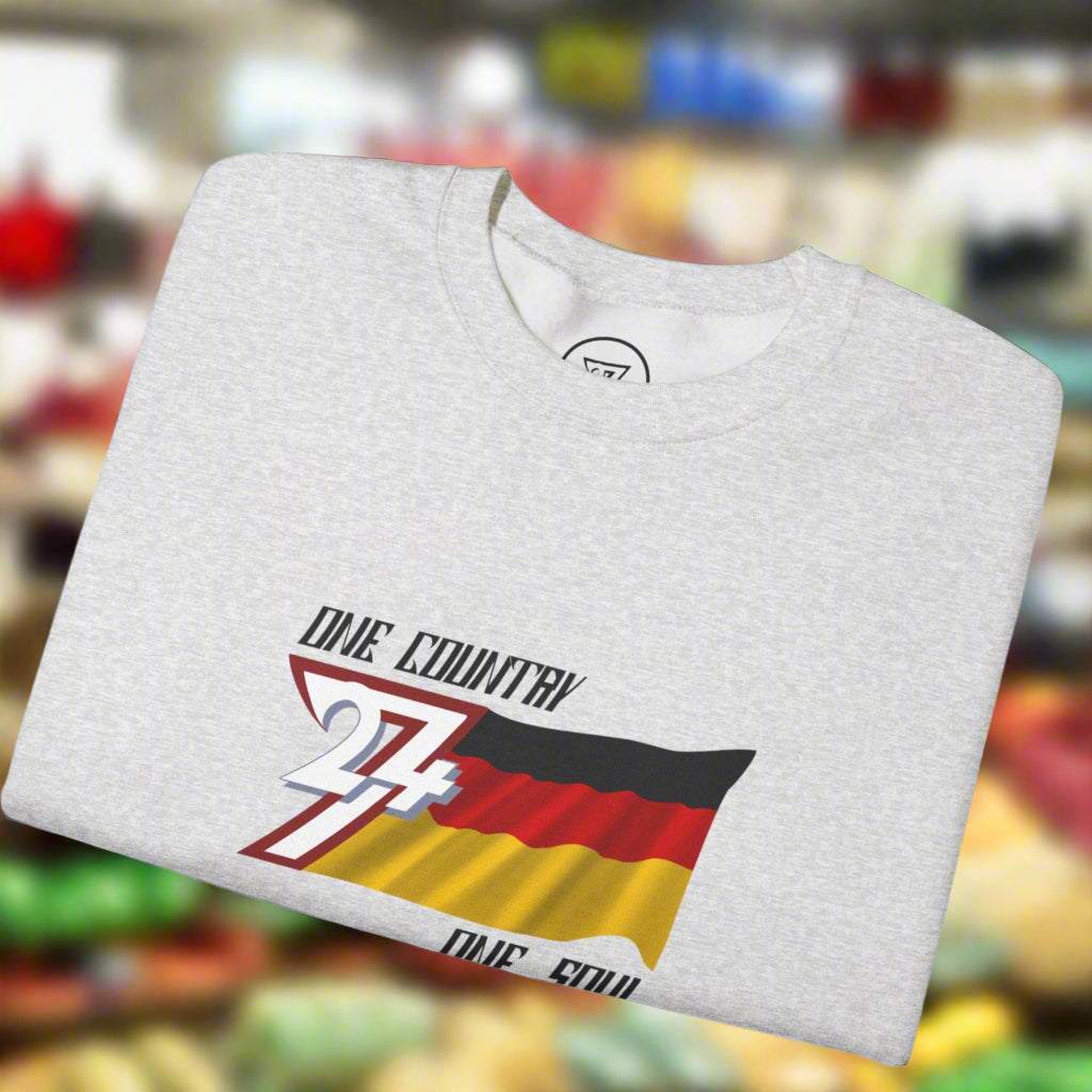 Folded gray sweatshirt with Germany flag design and text by 24/7 Unique Designs