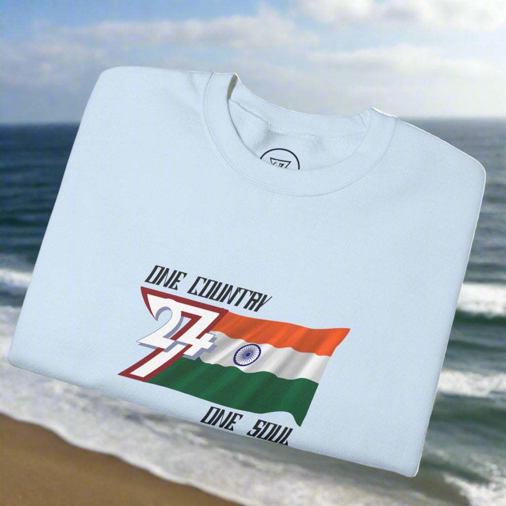 Folded light blue sweatshirt with India flag design and "One country one soul" slogan on chest.