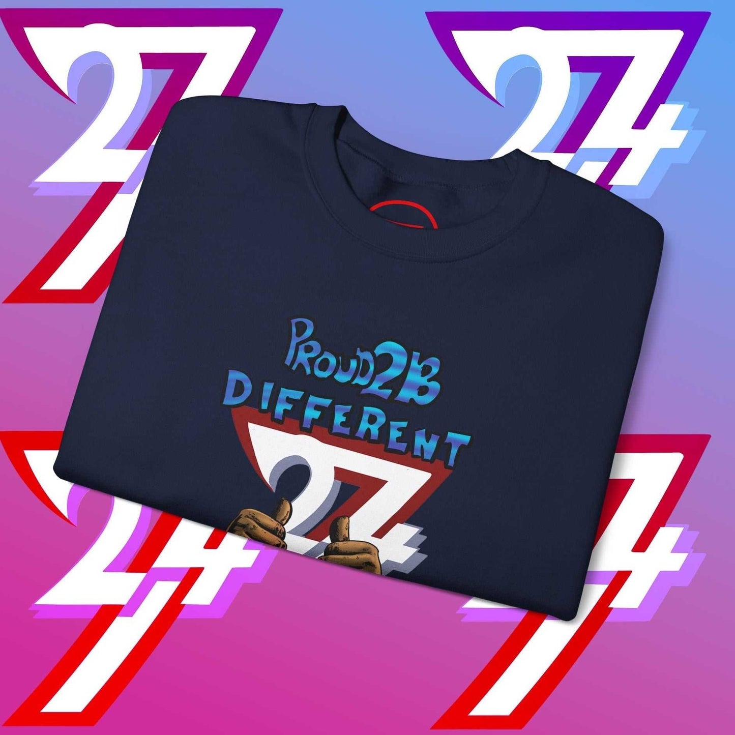 Folded navy blue artistic sweatshirt with "Proud 2 B Different" slogan and graphic on front against colorful number 27 backdrop