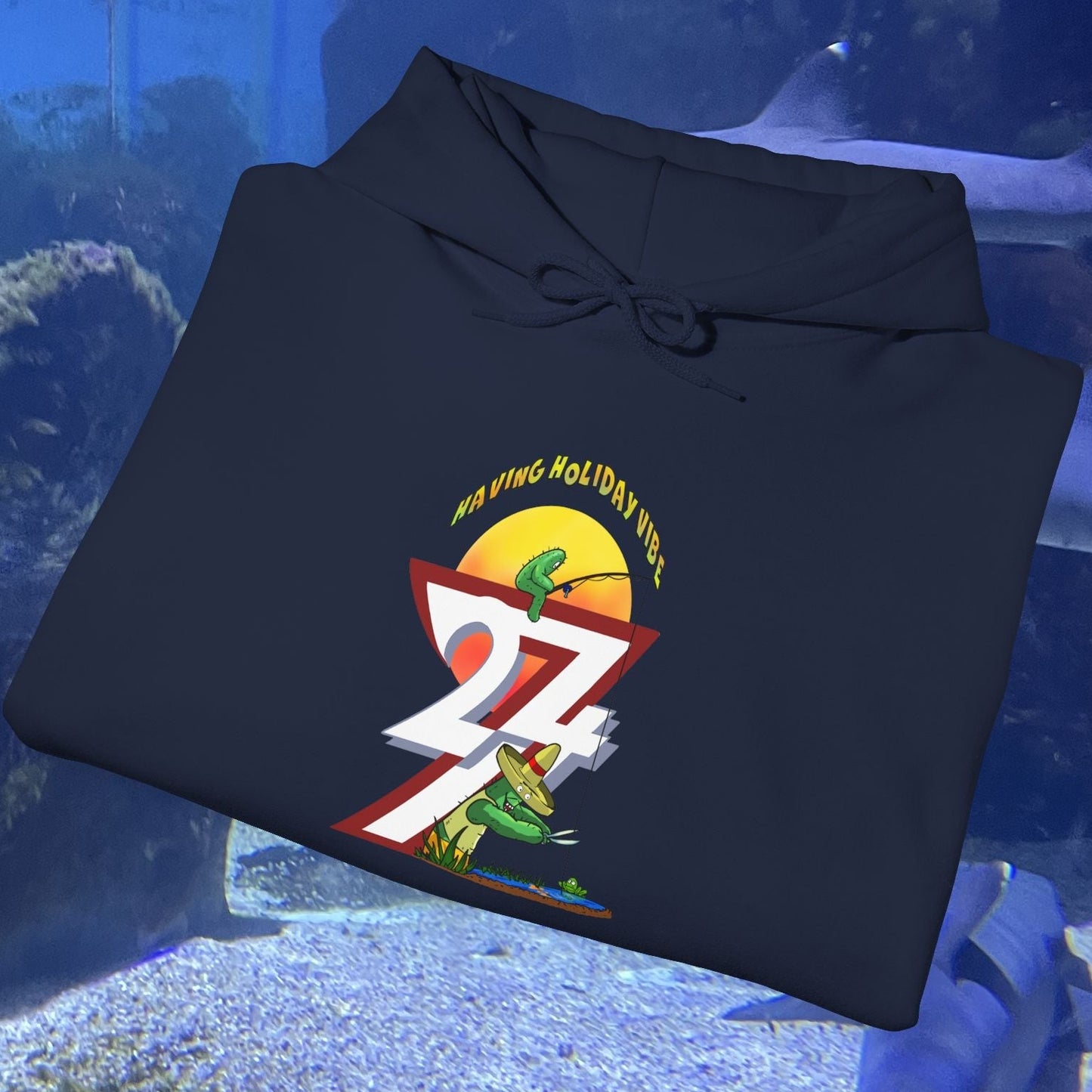 Funny Fishing Hoodie navy blue with cactus graphic and summer holiday design folded on a flat surface