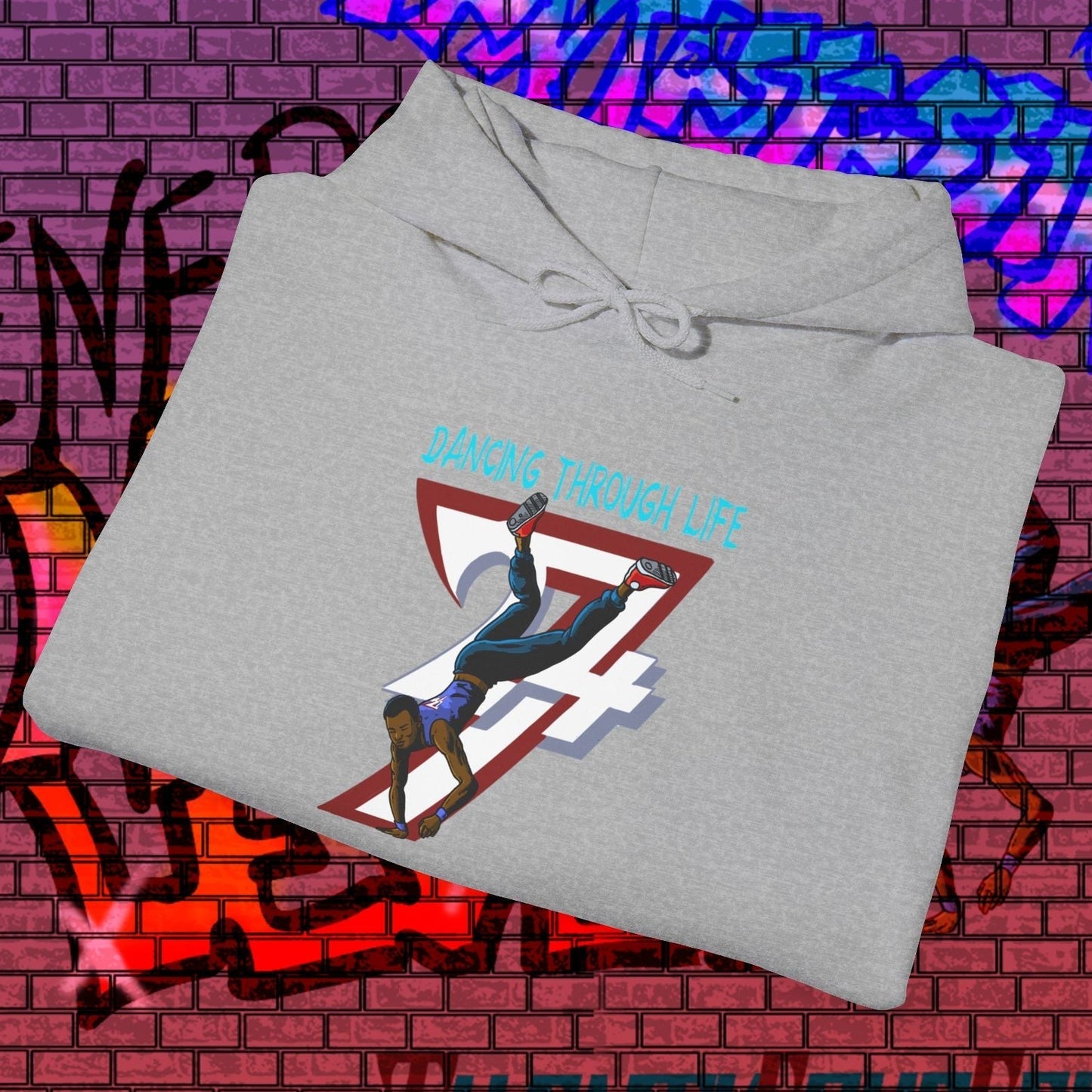 Grey street dance hoodie with hand-drawn dancer illustration and "Dancing Through Life" text on front