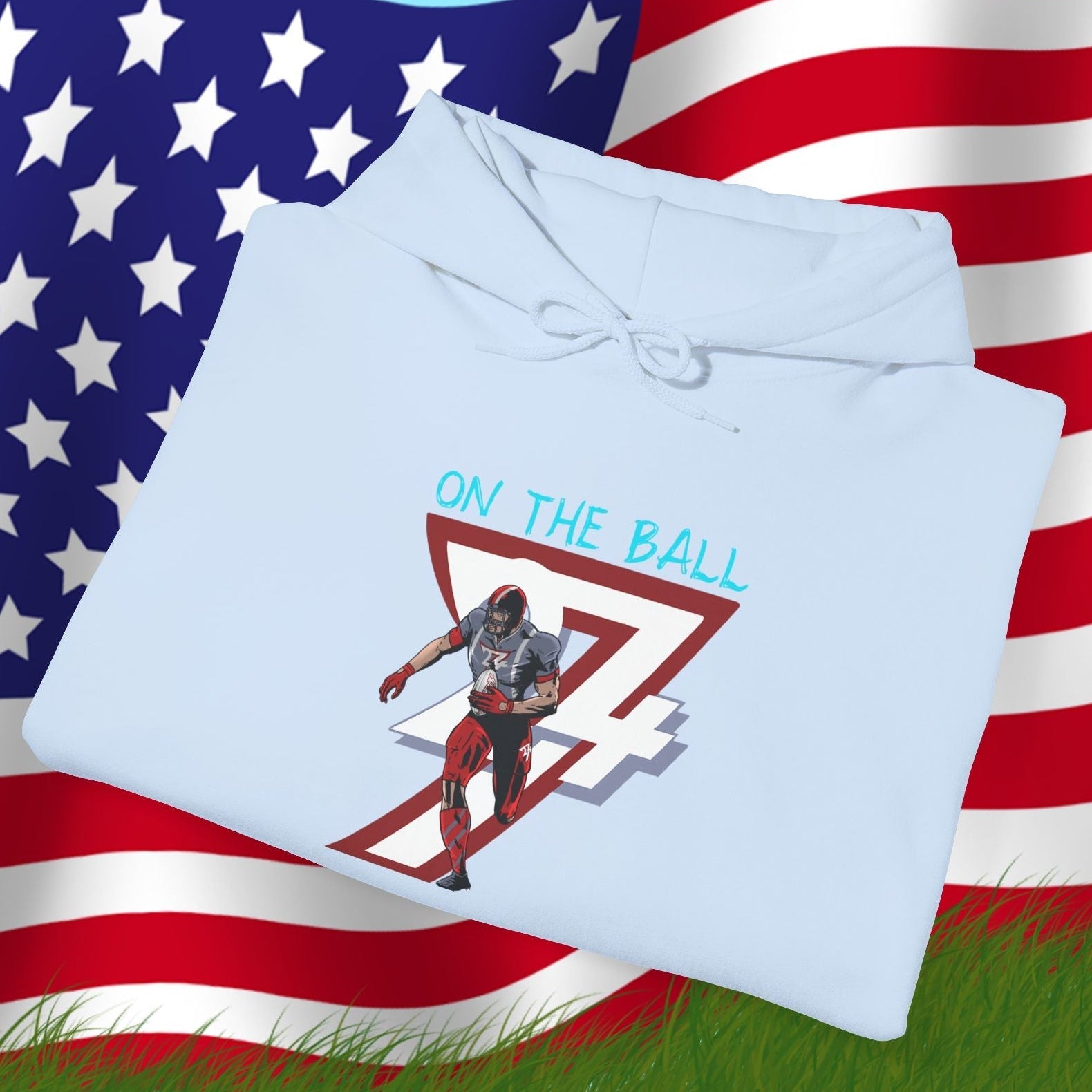 Light blue american football hoodie with hand-drawn player design and "ON THE BALL" text on an American flag background