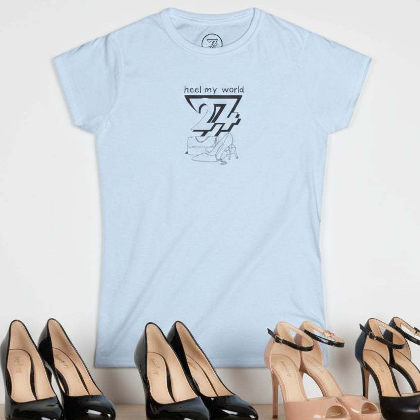 Light blue graphic tee for women with "heel my world" quote and black outline handbag and high heels design
