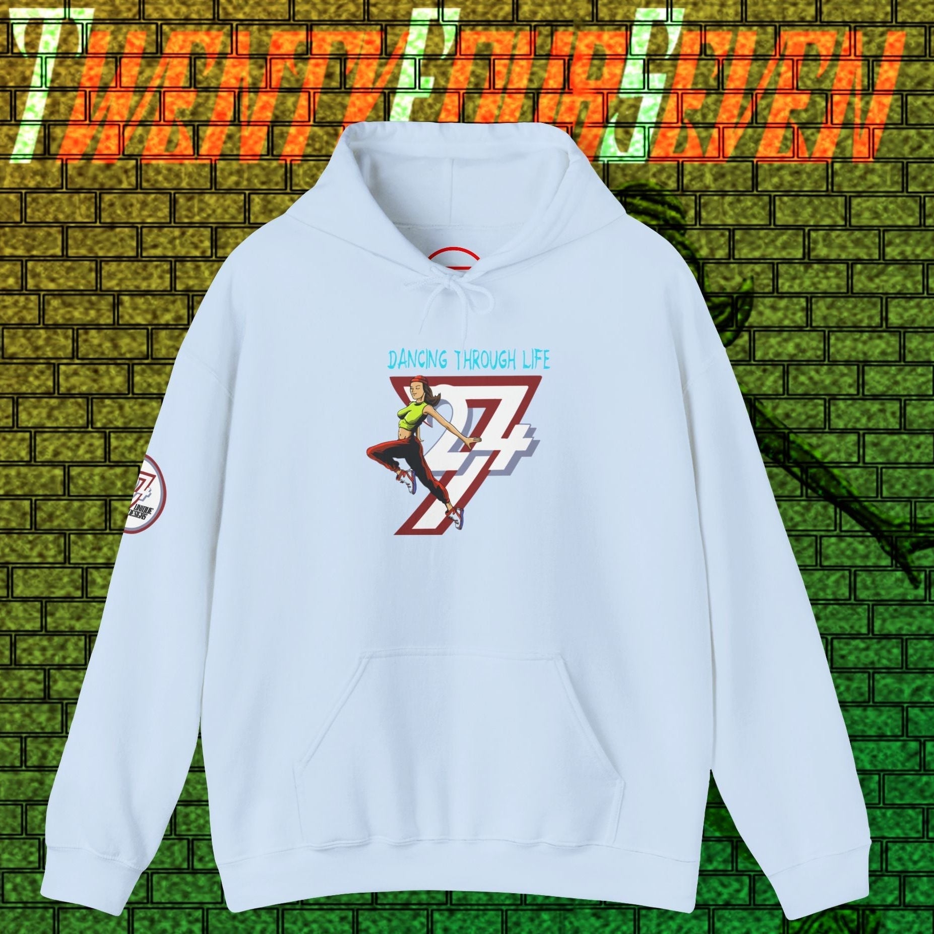 Light blue street dance hoodie for women with graphic print and kangaroo pouch pocket against graffiti wall background