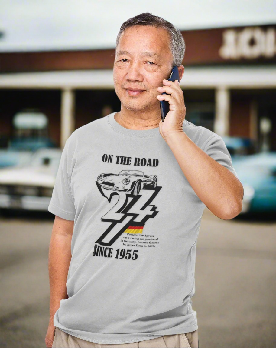 Man wearing a gray Vintage Porsche tee with black 1955 car illustration and "On The Road 24/7 Since 1955" text.