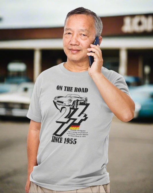 Man wearing a gray Vintage Porsche tee with black 1955 car illustration and "On The Road 24/7 Since 1955" text.