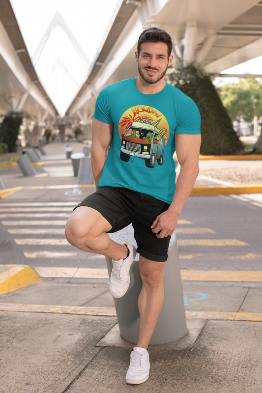 Man wearing turquoise cactus shirt with cartoon caravan design, black shorts, and white sneakers outdoors