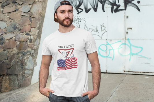 Man wearing white USA Flag t-shirt with patriotic design and text "Being a Patriot!" outdoors