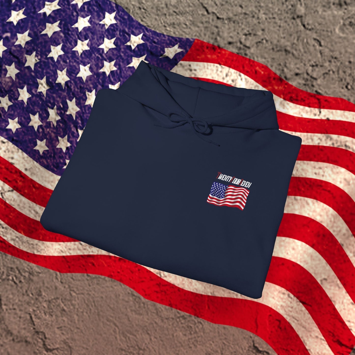 Navy blue US flag hoodie with small printed American flag folded on vintage US flag background