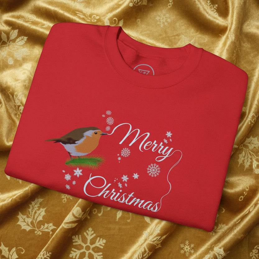 Red Christmas robin sweatshirt with festive "Merry Christmas" design and snowflakes on golden fabric background