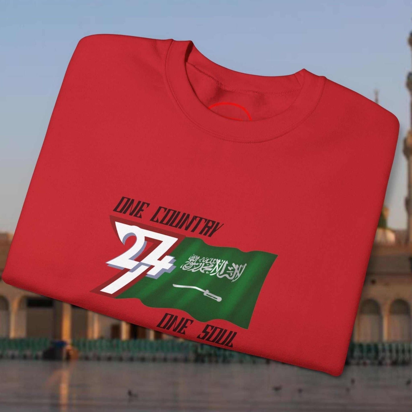 Red Saudi Arabia Flag crewneck sweatshirt with vibrant hand-drawn flag design and "One Country One Soul" text on front