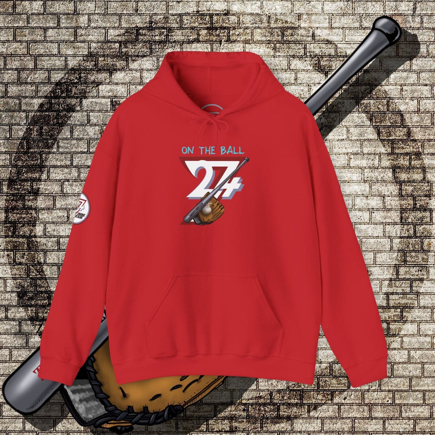 Red baseball hoodie with "On The Ball 24/7" graphic featuring baseball bat and glove, kangaroo pocket, and adjustable hood.