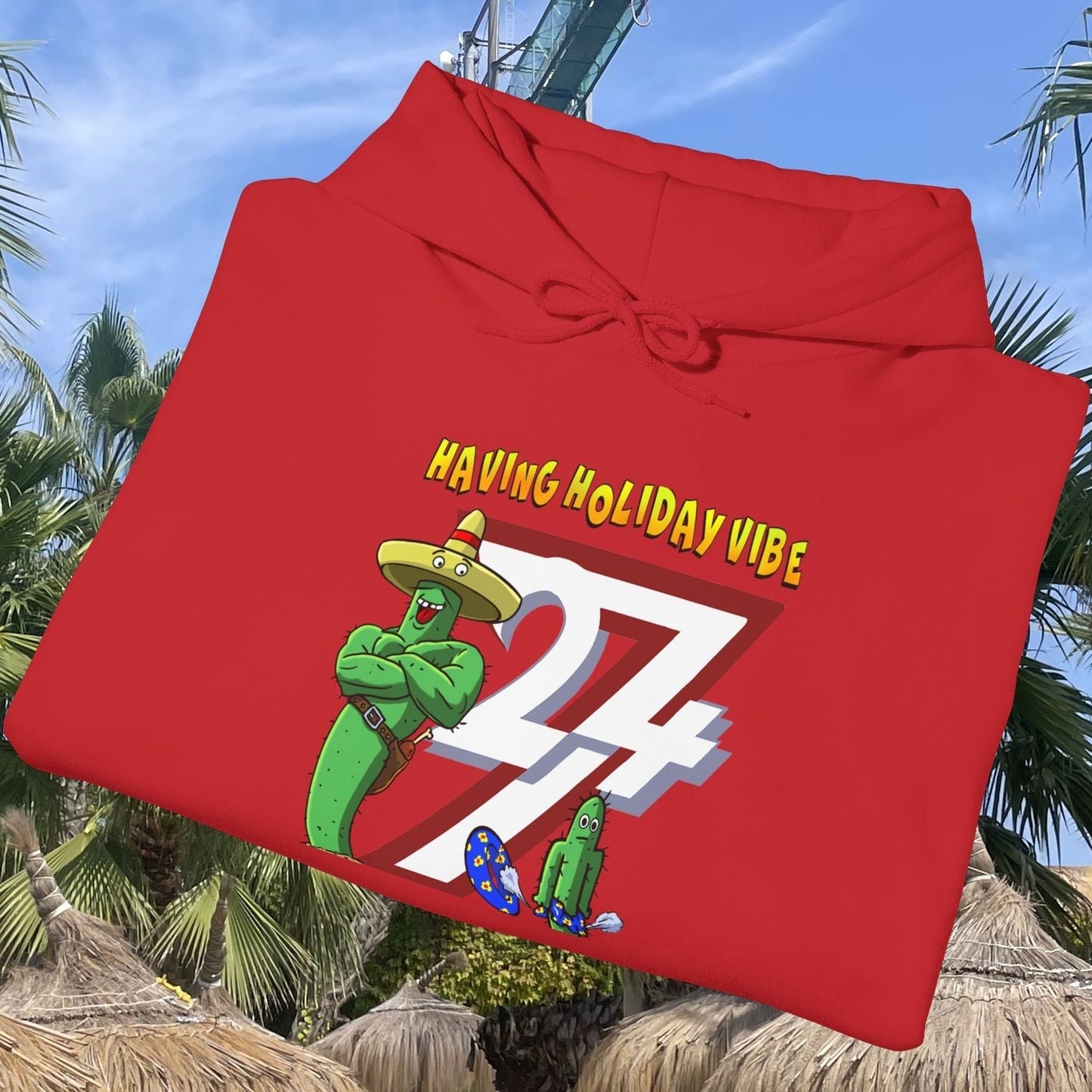 Red cactus hoodie with cartoon cactus character wearing a sombrero and "Having Holiday Vibe" text design