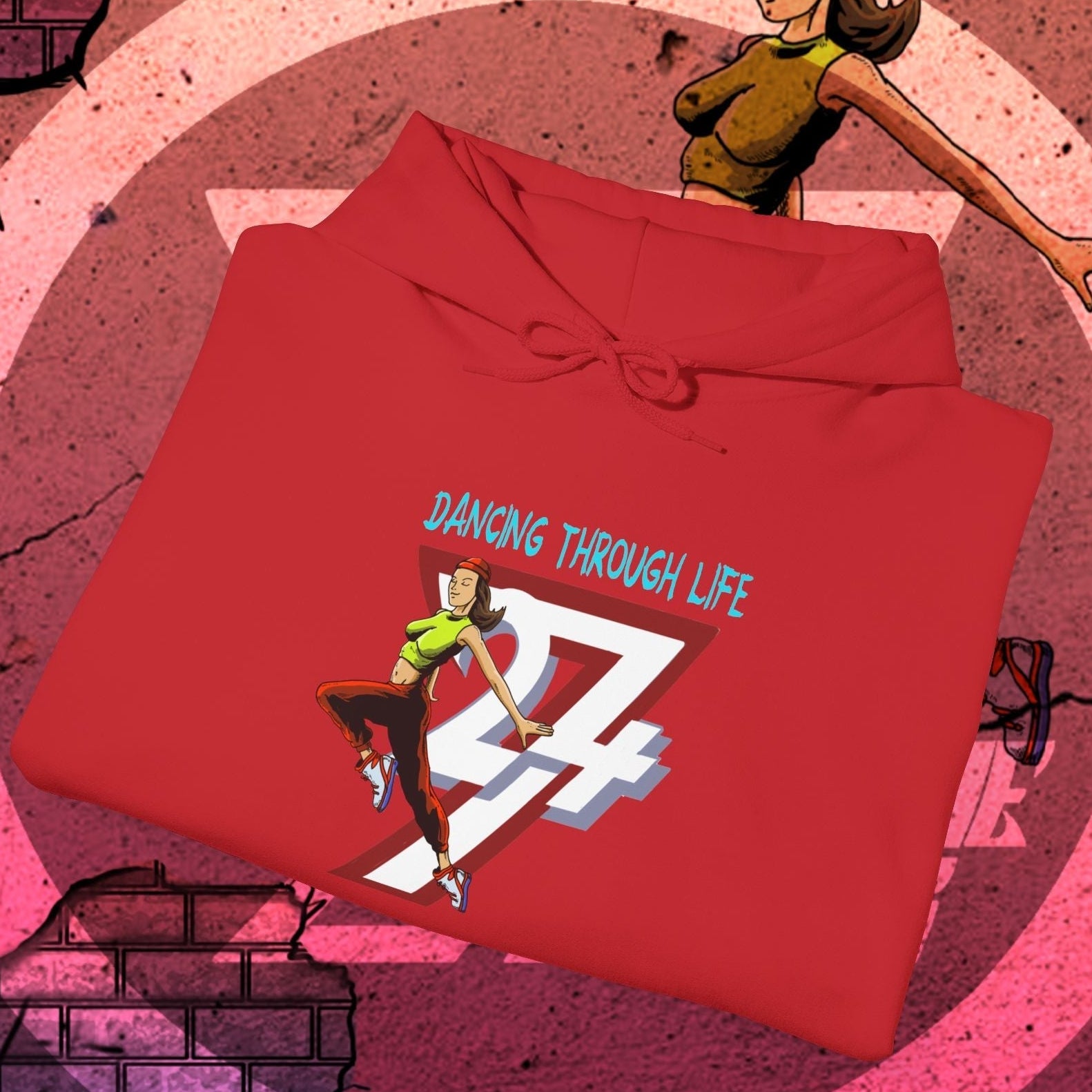 Red street dance hoodie for women with urban illustration and "Dancing Through Life" text, comfortable and stylish streetwear gift.