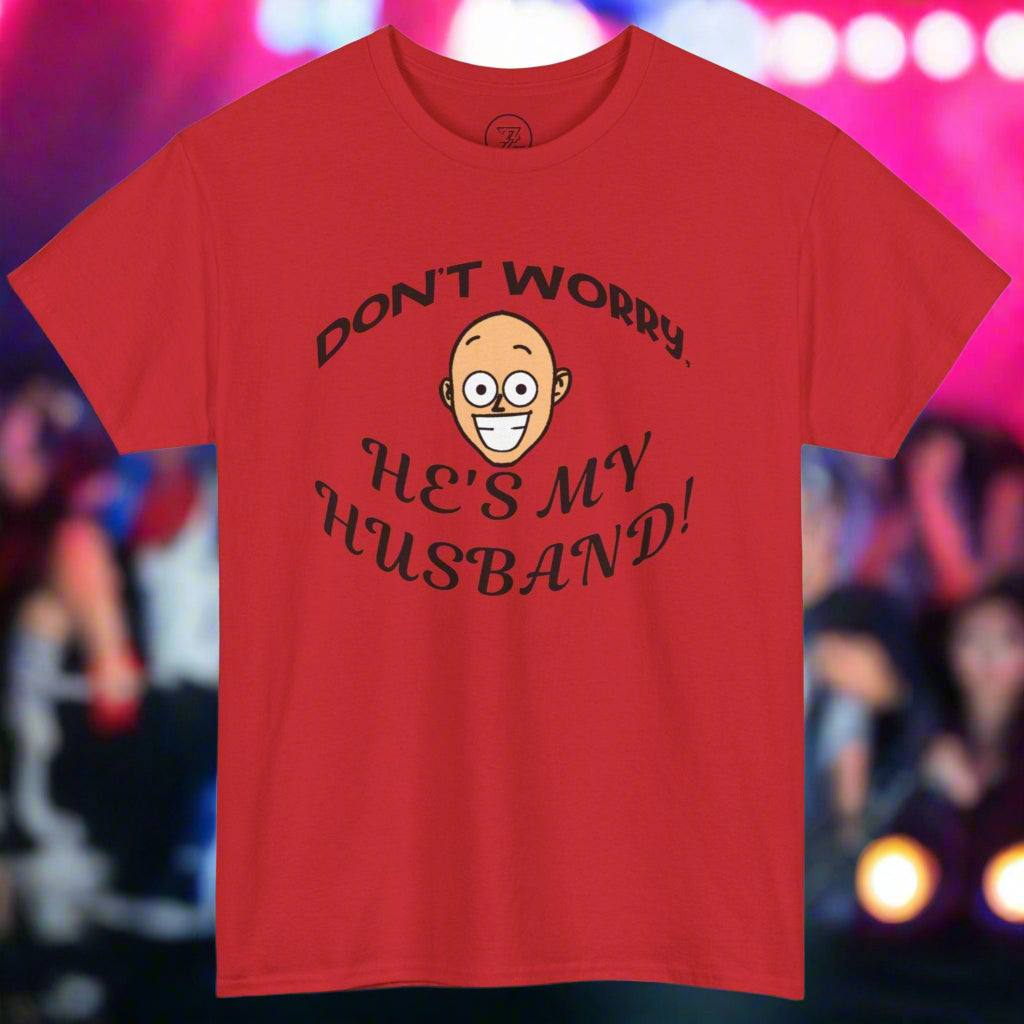 Red unisex heavy cotton T-shirt with funny "Don't worry, he's my husband!" kiss cam quote for concert goers