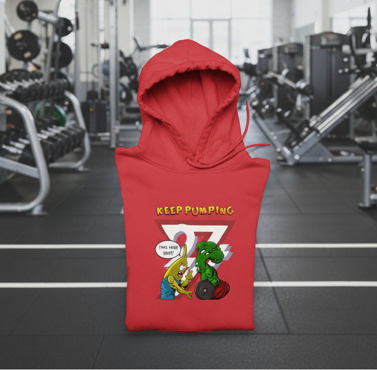 Red workout hoodie with cartoon broccoli and banana lifting weights and "KEEP PUMPING" text