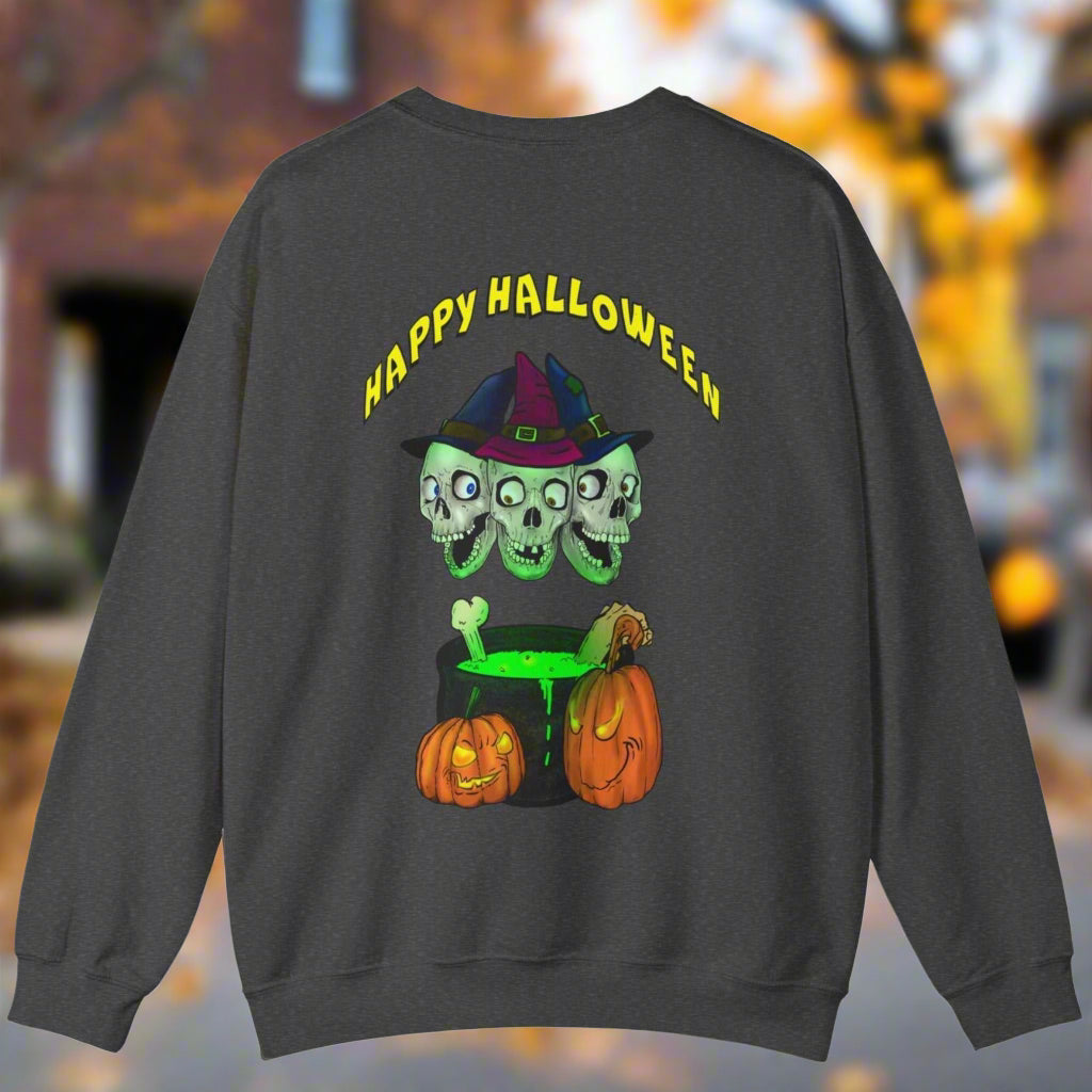 Dark Halloween sweatshirt with three skulls wearing a witch hat above a bubbling cauldron and two pumpkins, "Happy Halloween" text, spooky festive design