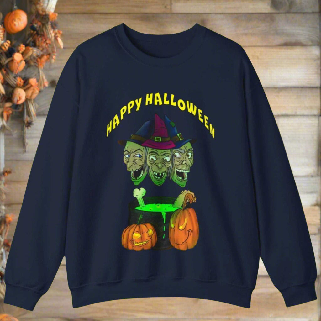 Halloween sweatshirt with three-headed witch, glowing green potion, and pumpkins on navy blue background