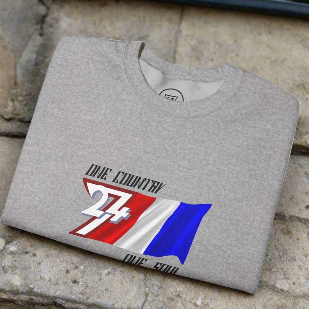 Folded grey unisex sweatshirt with hand-drawn France flag and "One Country One Soul" slogan graphic