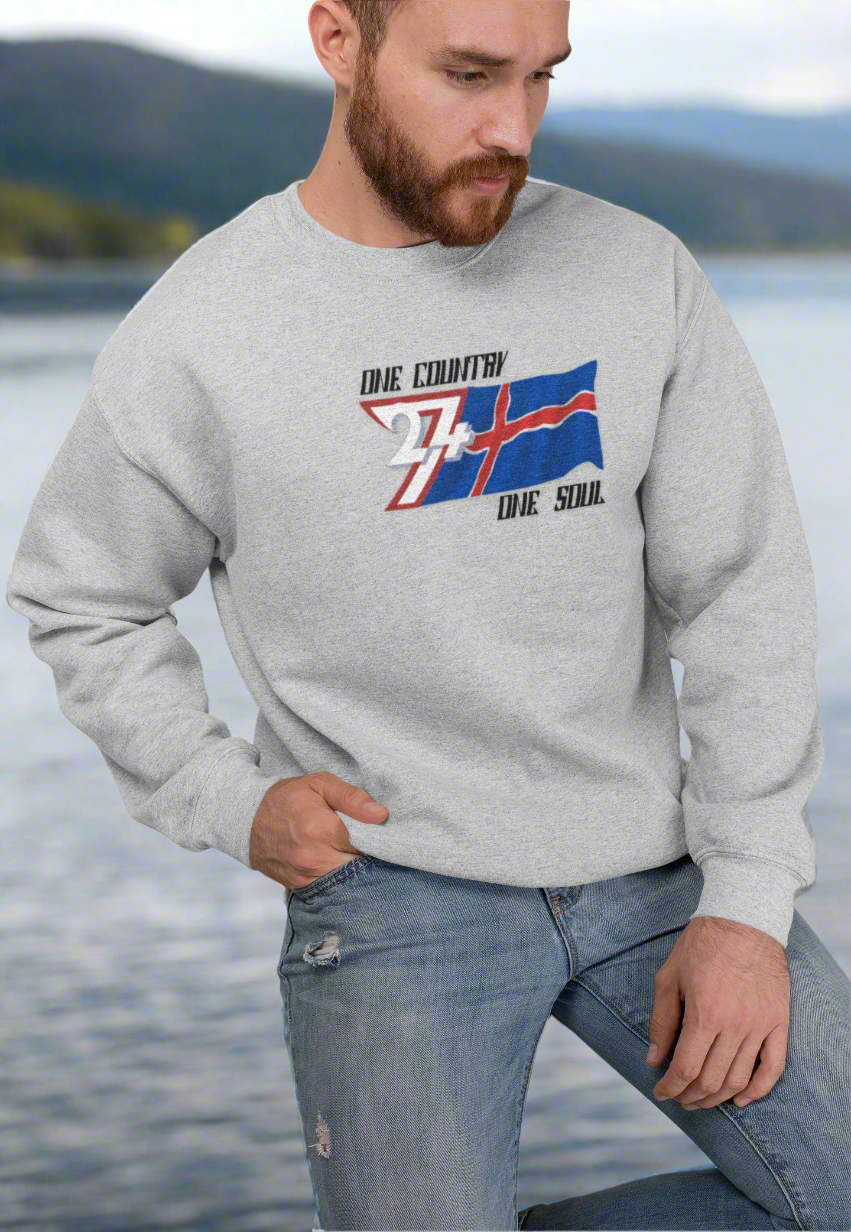 Unisex gray crewneck sweatshirt with hand-drawn Iceland flag and "One country one soul" slogan, cozy and stylish for winter.