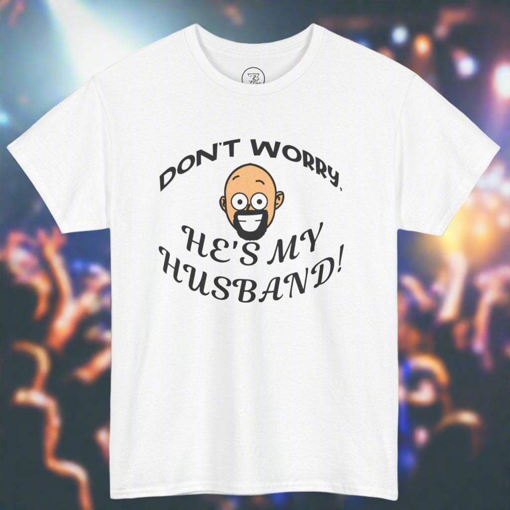 White Kiss Cam shirt with funny quote "Don't worry, he's my husband!" and cartoon face, unisex cotton tee for concert goers.