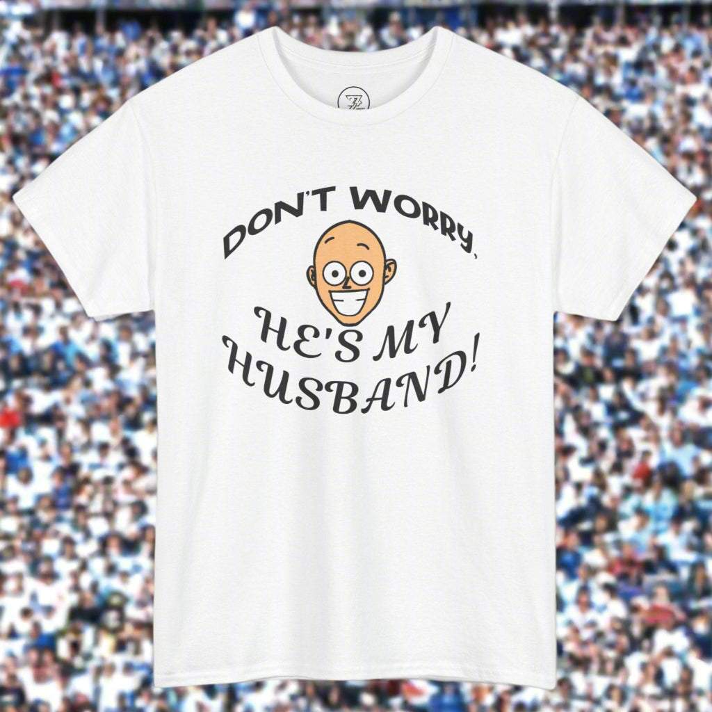 White unisex Kiss Cam T-shirt with funny "Don't worry, he's my husband!" quote and cartoon face design for concert goers