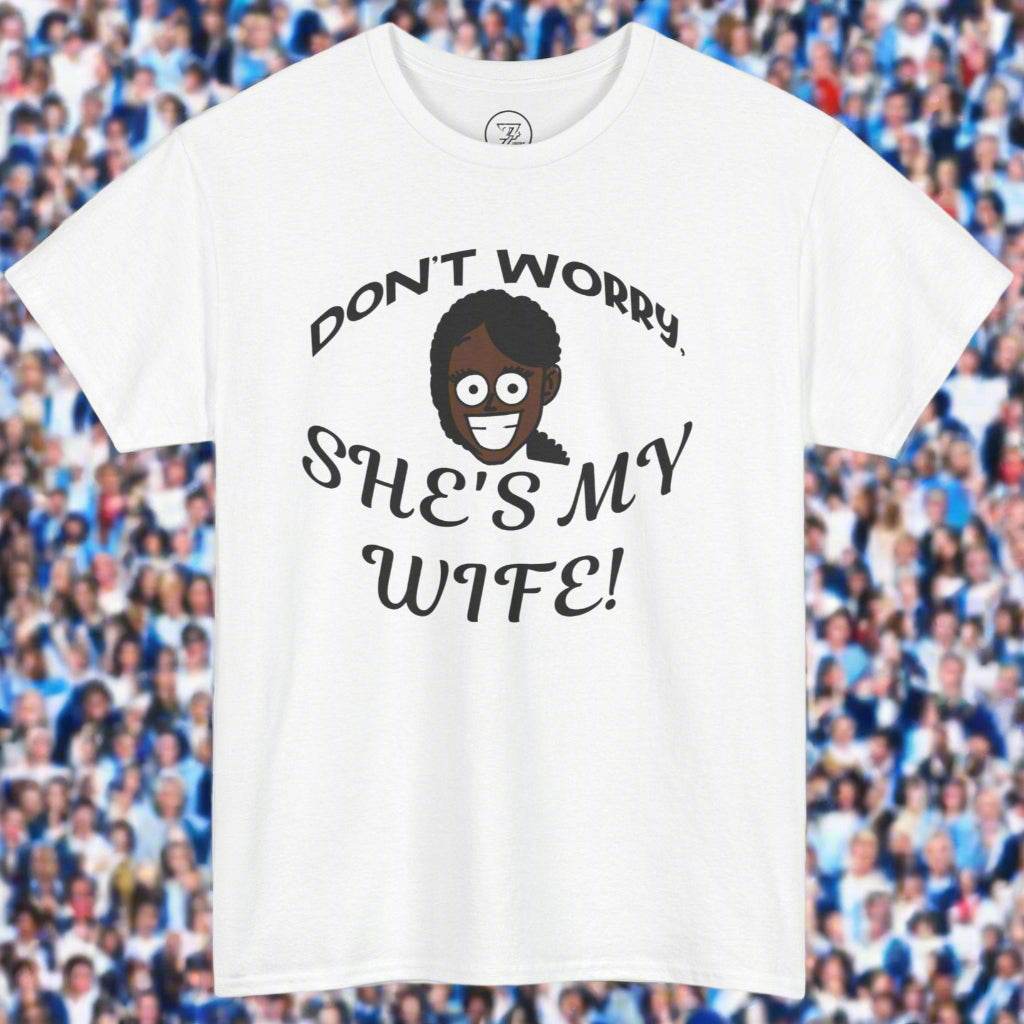 White unisex heavy cotton t-shirt with "Don't Worry, She's My Wife!" kiss cam funny quote and cartoon face design