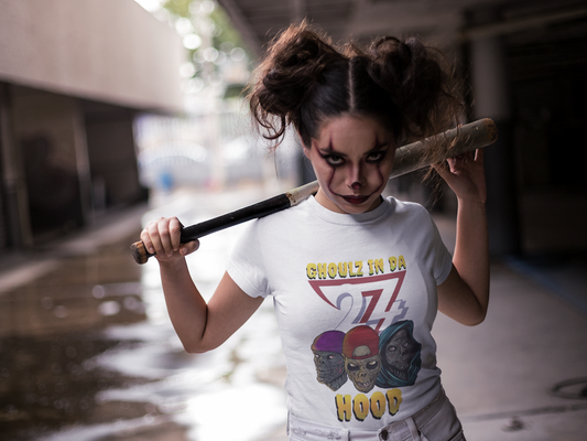 White zombie tee with colorful ghouls in hoodies and "Ghoulz in da Hood" text, urban Halloween design.