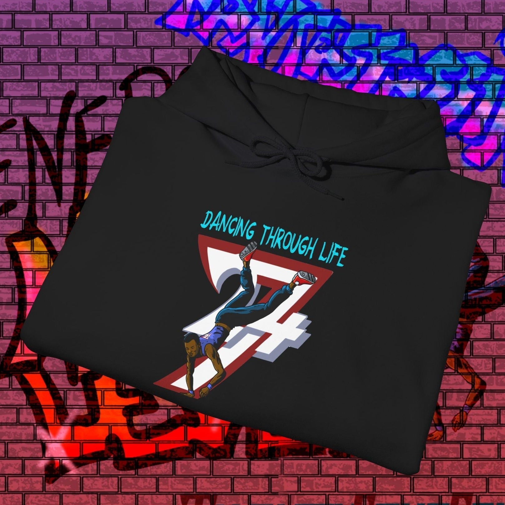 black street dance hoodie with hand-drawn dancer and "Dancing Through Life" text on front
