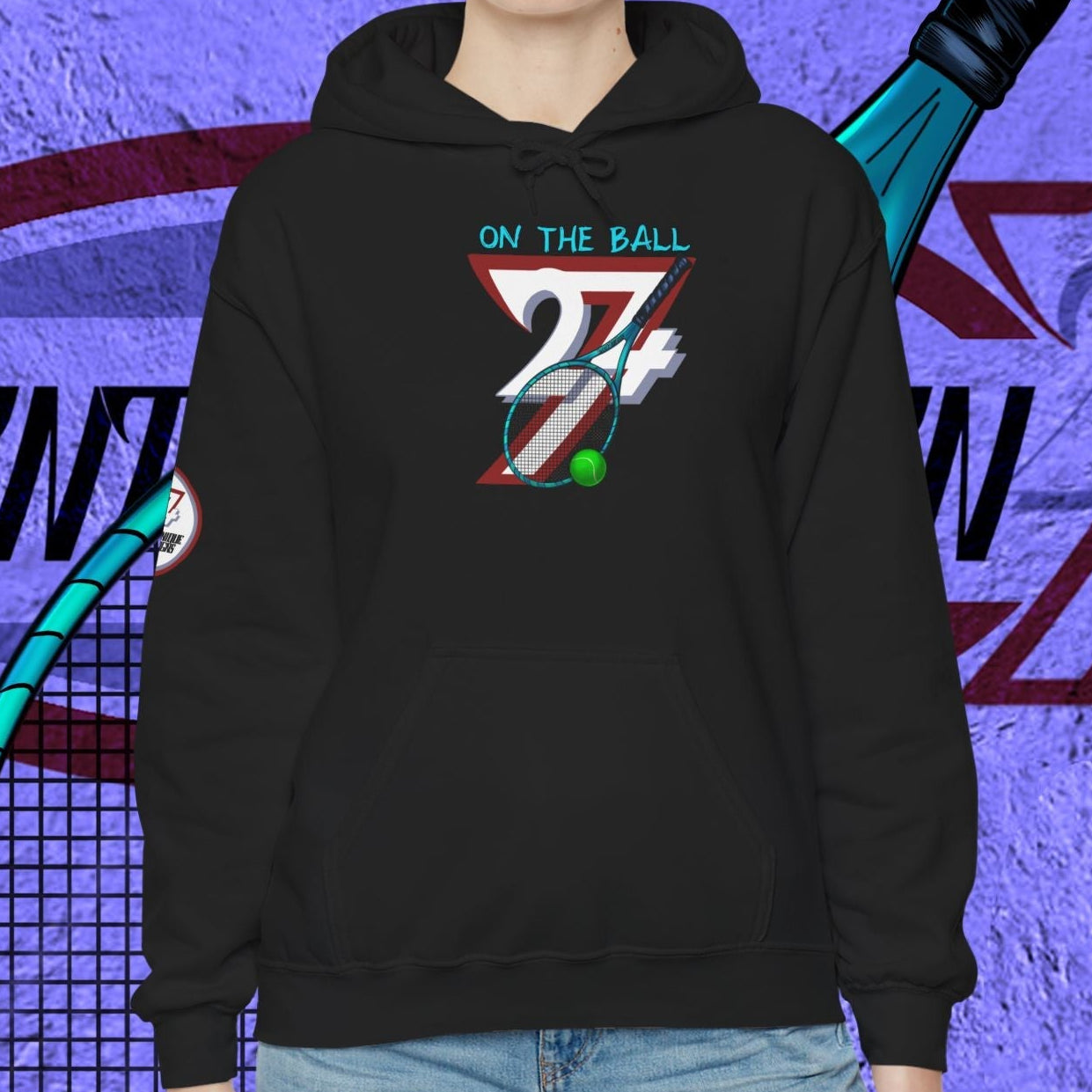 black unisex tennis hoodie with illustrated tennis gear design worn by smiling model