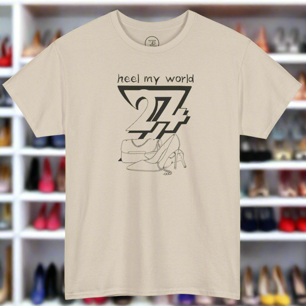 graphic tee with black high heel shoe and handbag illustration and "heel my world" quote on beige background