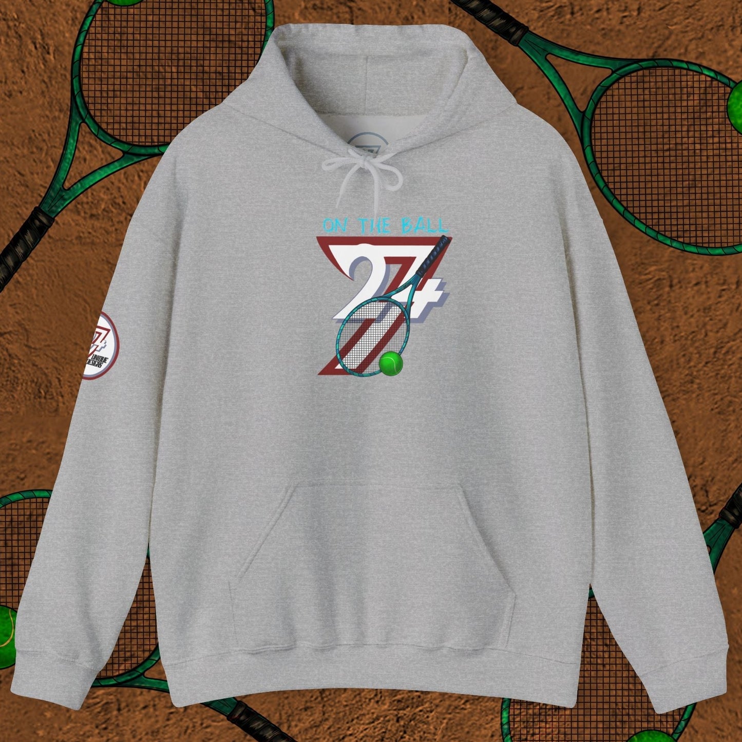 grey tennis hoodie with hand-drawn tennis gear design and kangaroo pocket on brown background with tennis rackets and balls pattern