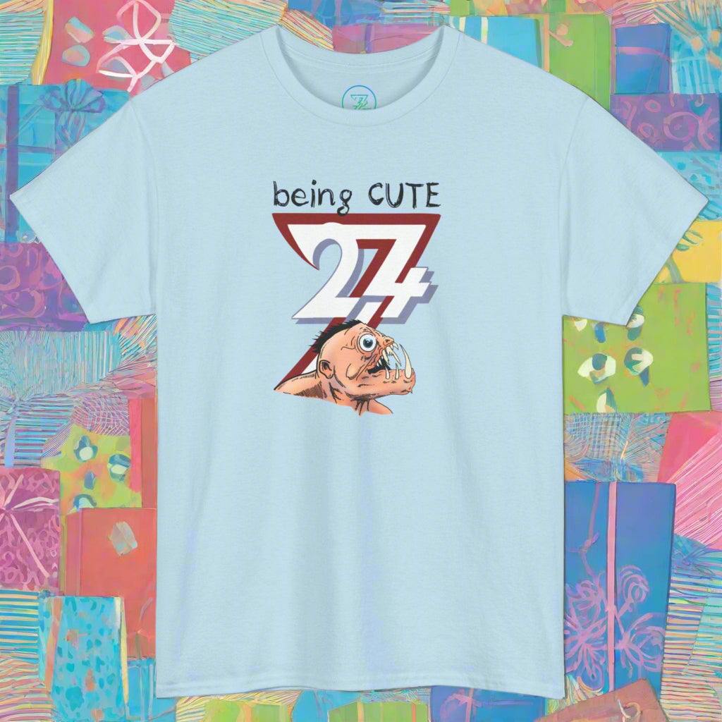light blue funny monster face cartoon tee with "being CUTE 27" text design