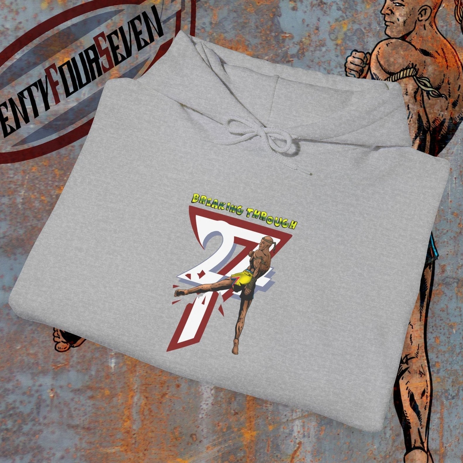 muay thai hooded sweatshirt with fighter graphic and "Twenty Four Seven" text on gray fabric, designed for martial arts enthusiasts