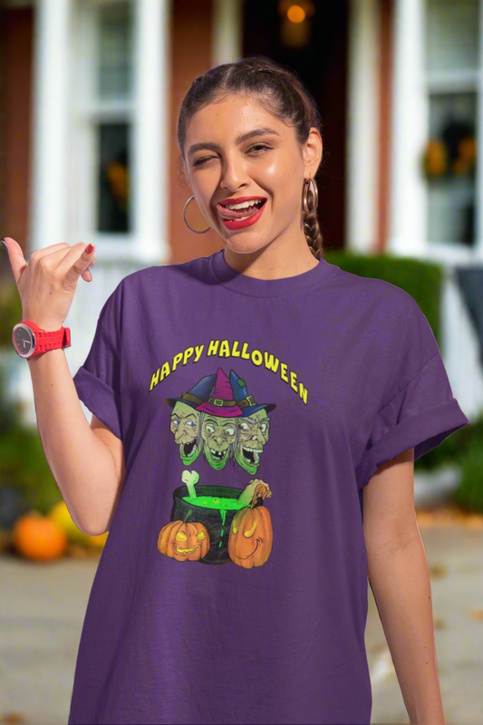 Young woman wearing purple Halloween Witches Tee with colorful witch cartoon and pumpkins design, smiling against pink background