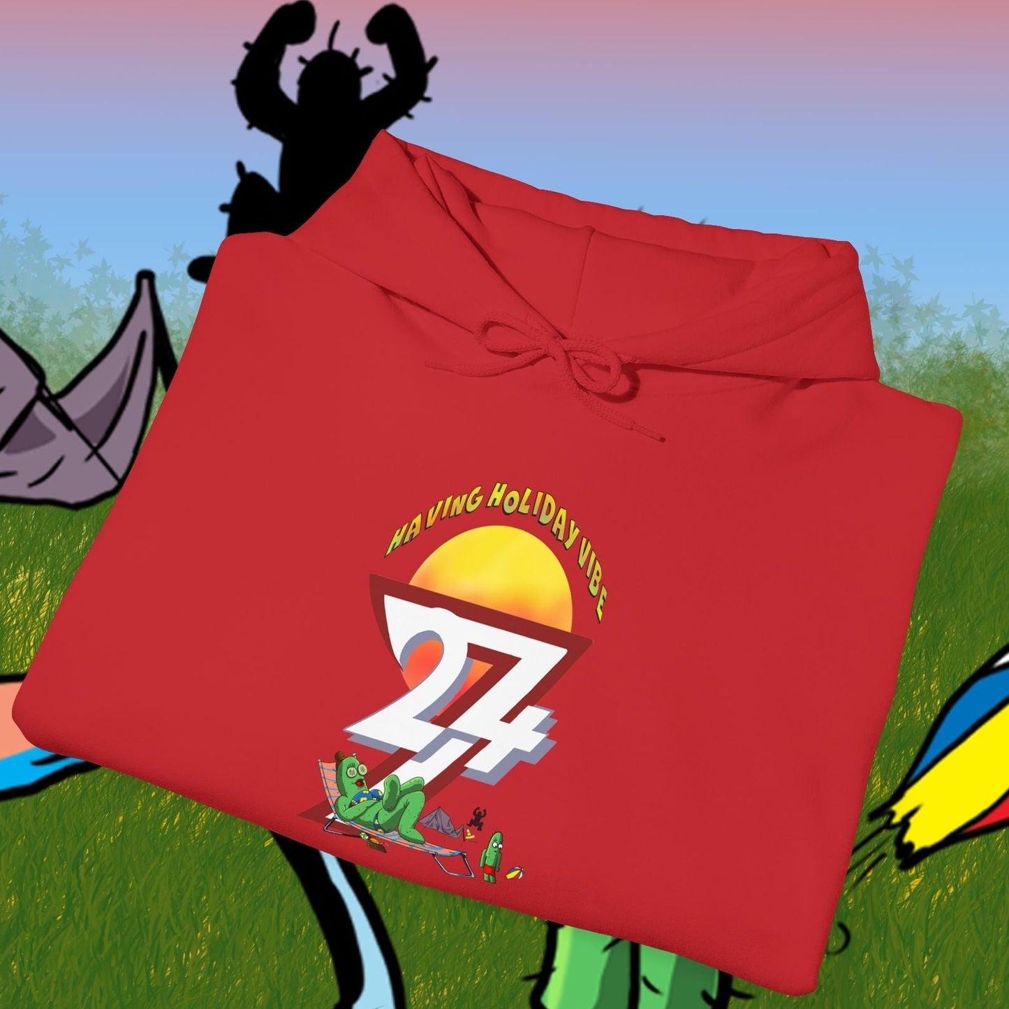 red cactus hoodie with cartoon design and camping theme folded on illustrated outdoor background