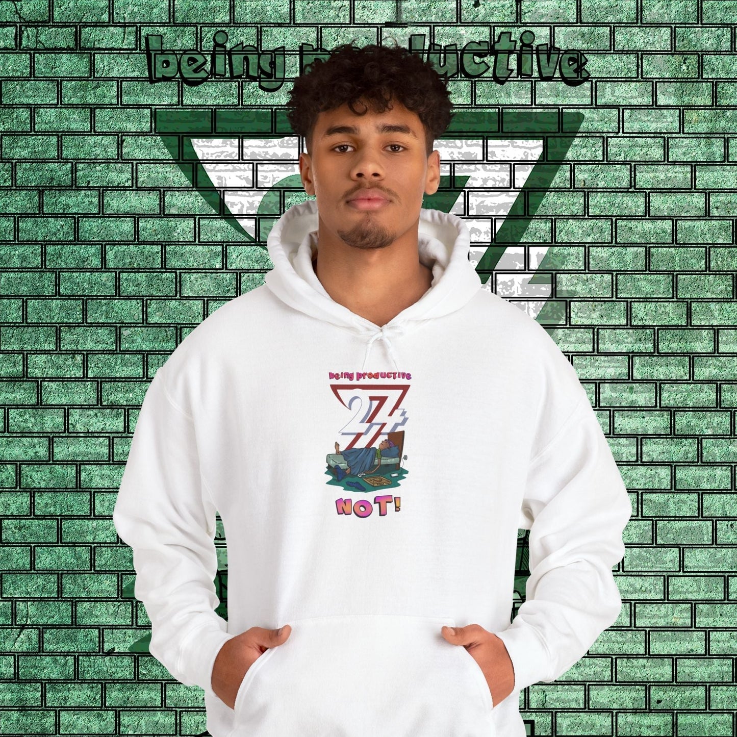 white funny custom hoodie with cartoon lazy teen design worn by male model against green brick wall background