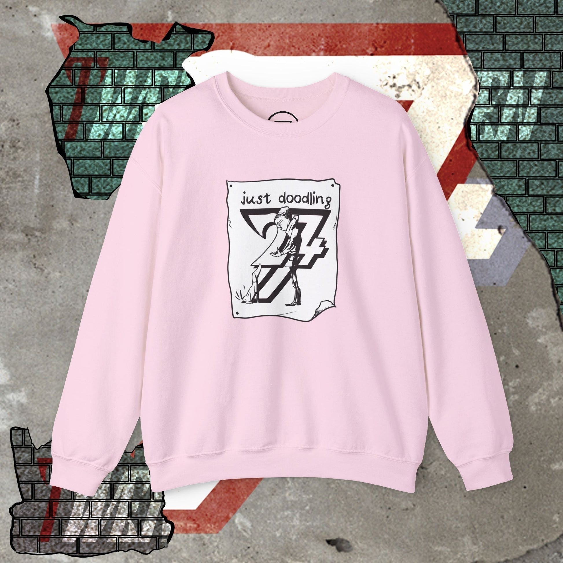 Pink caricature dog illustration sweatshirt with "just doodling" art design, casual streetwear.