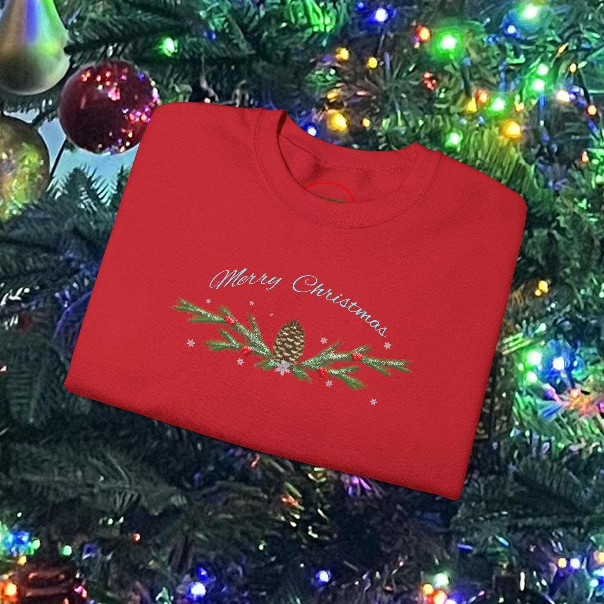 Red Pinecone Christmas sweatshirt with festive pinecone and greenery design on holiday tree background