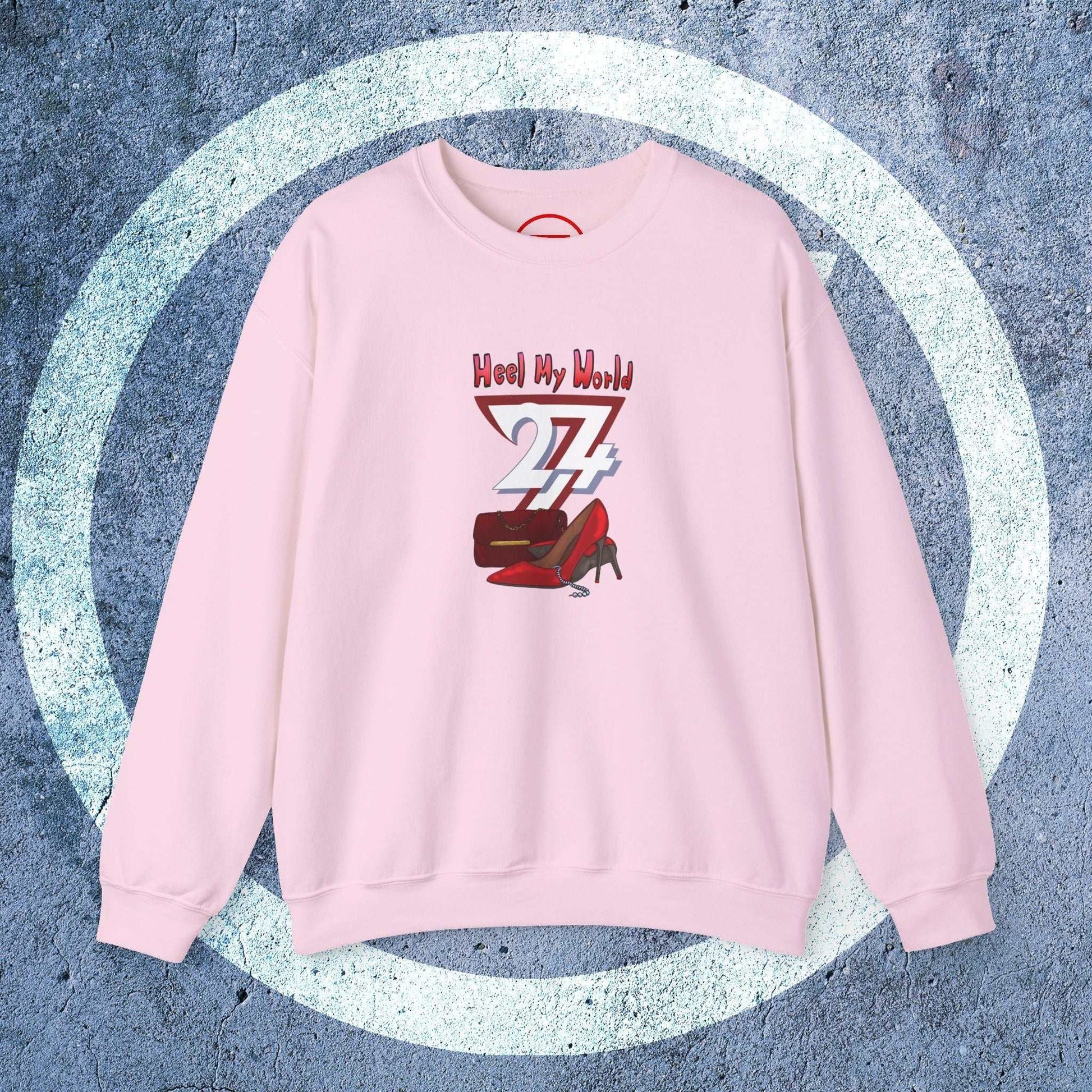 Pink women's graphic sweatshirt with handbag and high-heel design and "Heel My World" text