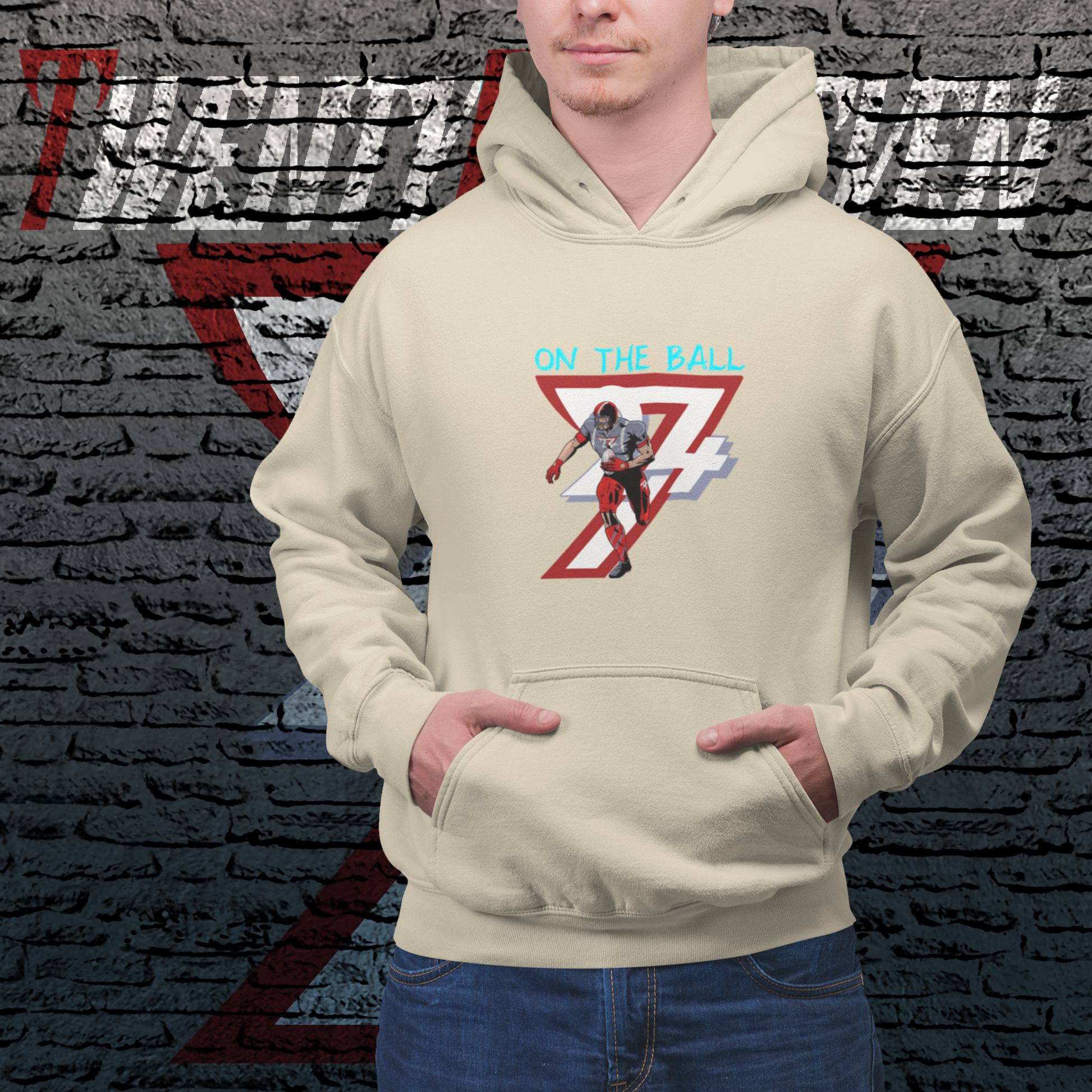 American football hoodie with hand-drawn player design and "On The Ball" text on beige fabric